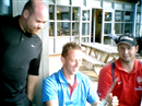 Lee and Wes looking at Shaun's trophy
