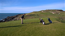 Yours truly before thinning one into the rocks on the left at Nefyn golf club